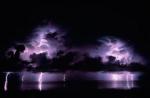 Picture with night thunderstorm on sea