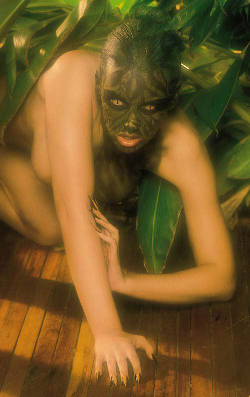 Bodyart with masked as jungle model