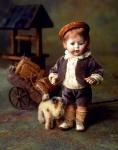 Boy-doll in the country side with the dog