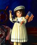 Photo of doll with flag accompanying sailor