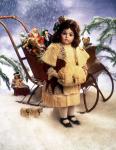 Doll on winter near sleigh