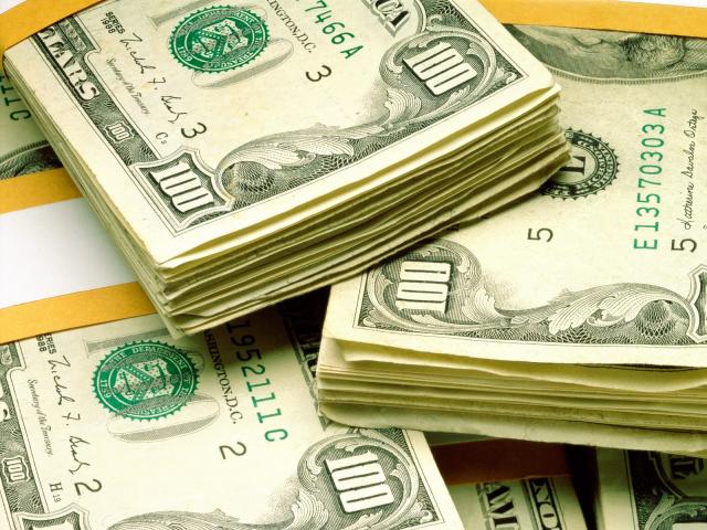 Photo of packs hundred dollar denominations