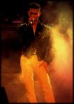 Photo of David Gahan's singing in white jeans and black leather jackets