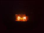 Photograph of burning letters DM